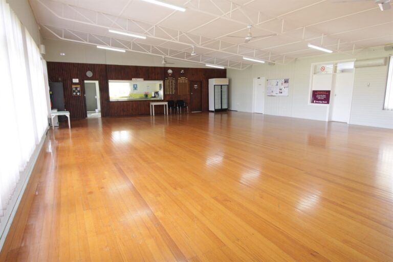 The main hall seen from the entrance doors, with the servery hatch and honour boards along the far wall